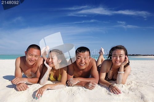 Image of group of happy young people have fun on bach