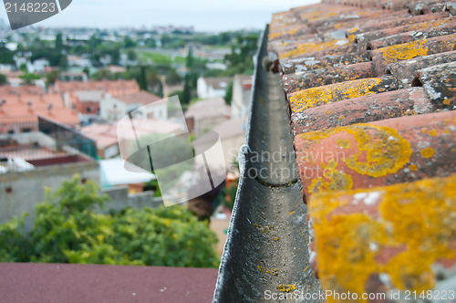 Image of Rain gutter on the old tile roof