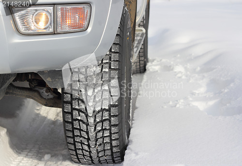 Image of Snowy winter road ahead an unrecognizable car