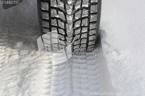 Image of Snowy winter road ahead an unrecognizable car