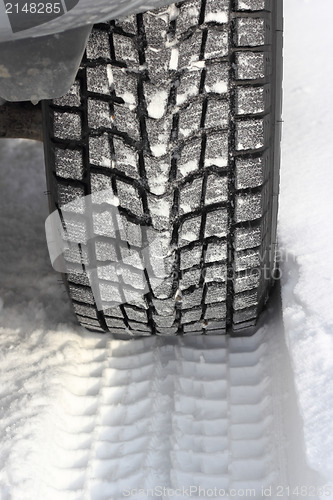 Image of Snowy winter road ahead an unrecognizable car