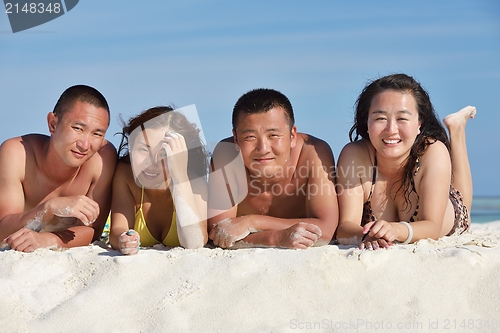 Image of group of happy young people have fun on bach