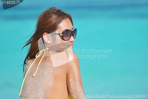 Image of beautiful  woman resting on tropical  beach