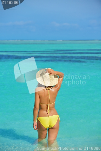Image of beautiful  woman resting on tropical  beach