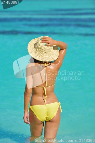 Image of beautiful  woman resting on tropical  beach