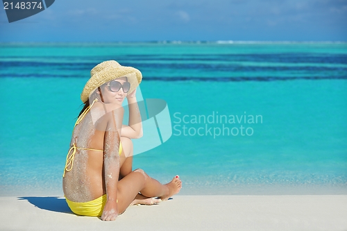 Image of beautiful  woman resting on tropical  beach