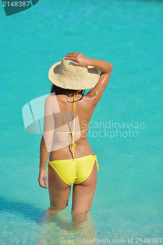 Image of beautiful  woman resting on tropical  beach