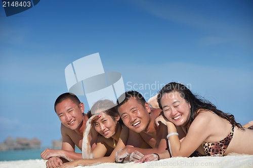 Image of group of happy young people have fun on bach