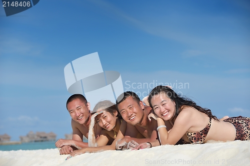 Image of group of happy young people have fun on bach