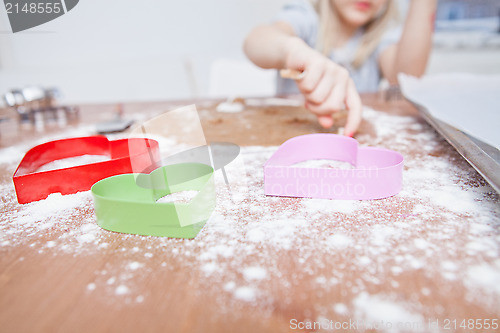 Image of Young girl making gingerbread
