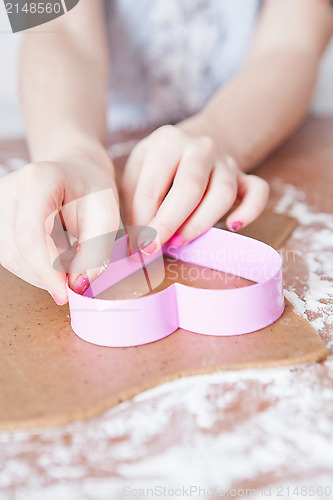 Image of Young girl making gingerbread