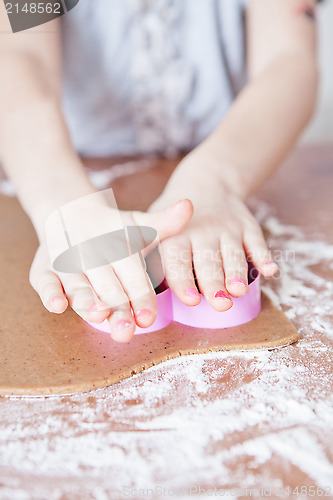 Image of Young girl making gingerbread