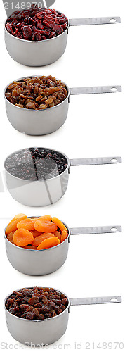 Image of A variety of dried fruit in cup measures