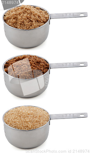 Image of Three different sugars in cup measures