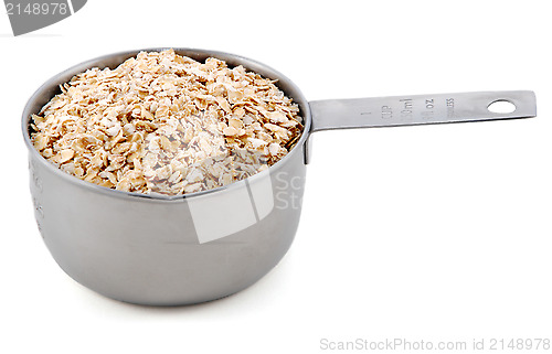 Image of Porridge oats presented in an American metal cup measure