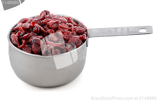 Image of Dried cranberries presented in an American metal cup measure