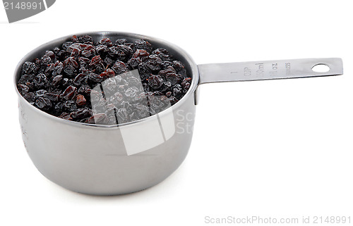 Image of Currants presented in an American metal cup measure