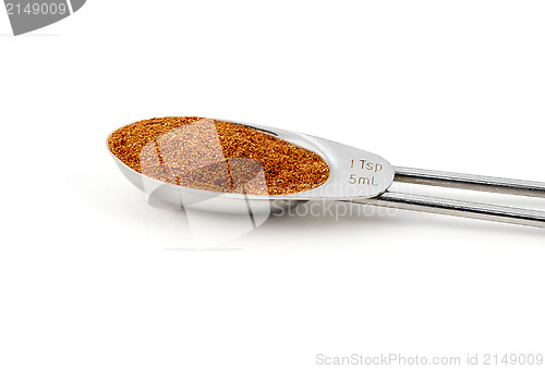 Image of Chinese five spice measured in a metal teaspoon
