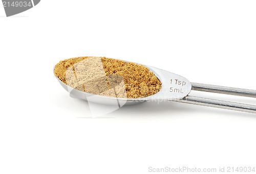 Image of Ground cumin measured in a metal teaspoon