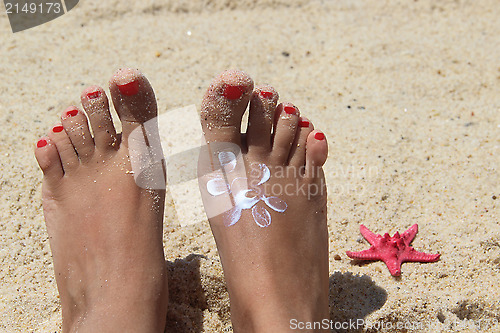 Image of Female feet on the beach