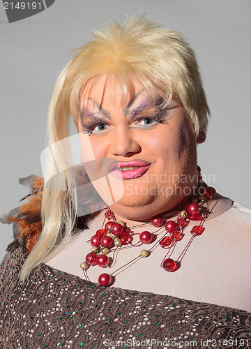 Image of Cheerful man, Drag Queen, in a Female Suit