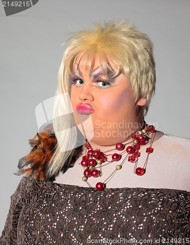 Image of Cheerful man, Drag Queen, in a Female Suit