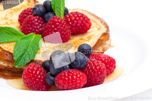 Image of Delicious Freshly Prepared Pancakes with Honey and Berries