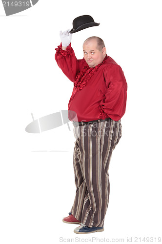 Image of Obese man in a red costume and bowler hat