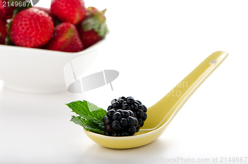 Image of Blackberries in ceramic spoon