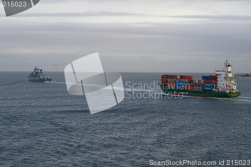 Image of Container ship and german naval ship.