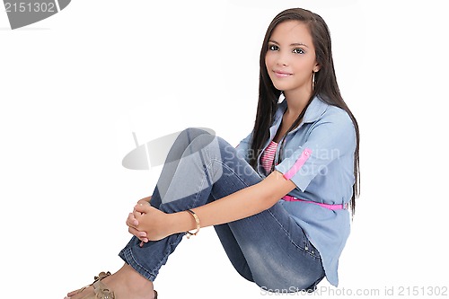 Image of Happy college girl sitting on floor