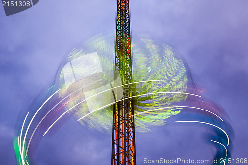 Image of Danger carousel - big wheel in motion at night