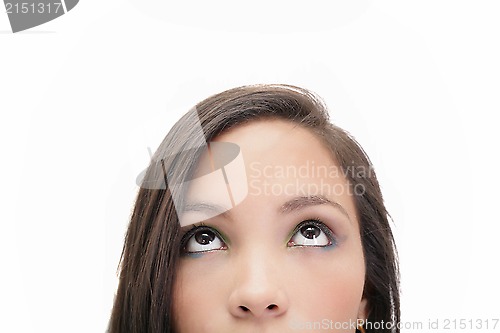 Image of Closeup portrait of a beautiful young woman looking up, isolated