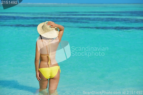 Image of beautiful  woman resting on tropical  beach