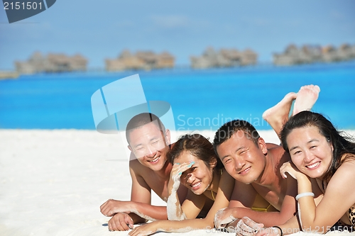 Image of group of happy young people have fun on bach