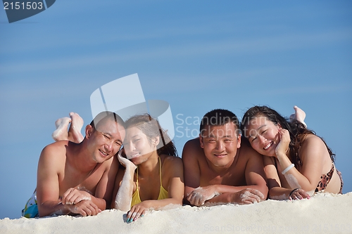 Image of group of happy young people have fun on bach