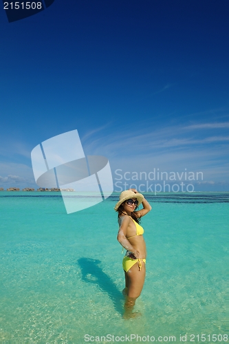 Image of beautiful  woman resting on tropical  beach
