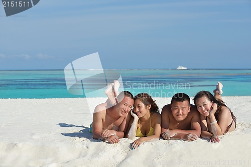 Image of group of happy young people have fun on bach