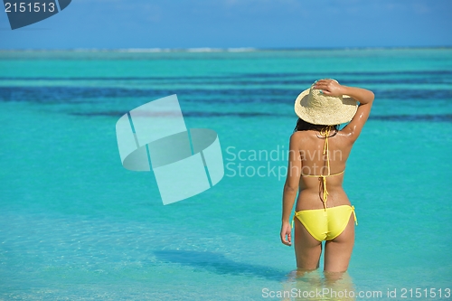 Image of beautiful  woman resting on tropical  beach
