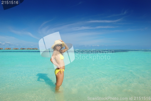 Image of beautiful  woman resting on tropical  beach