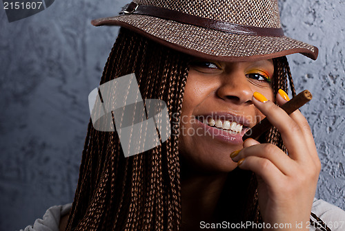 Image of portrait of a black girl with a cigar