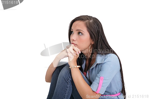 Image of portrait of sad pretty girl cuddling on the floor 