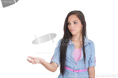 Image of beautiful woman showing something on the palm of her hand 