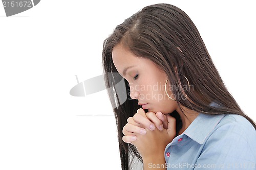 Image of A young woman praying with her hands together on white backgroun
