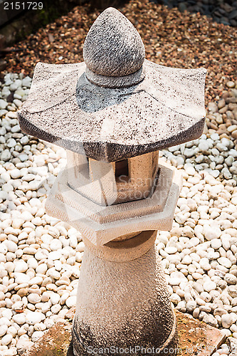 Image of Oriental pavillion rock lamp decorated in zen garden