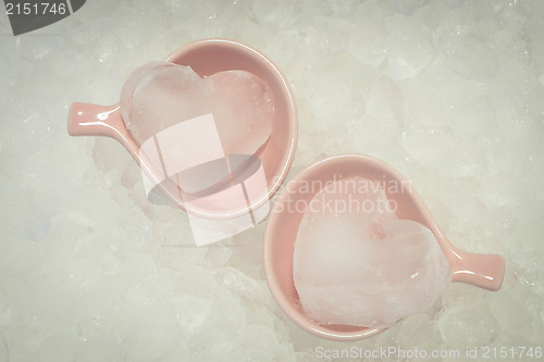 Image of Couple ice hearts on ice texture background