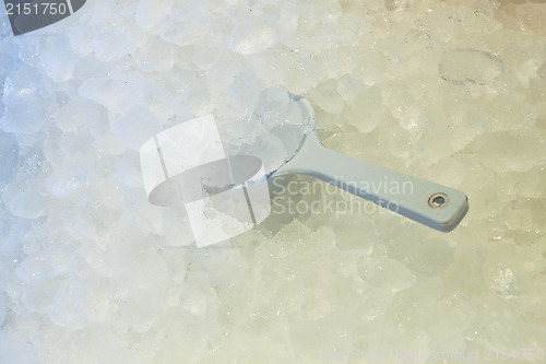 Image of Ice spoon in fresh cool ice background 