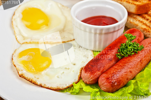 Image of Fried eggs with sausages