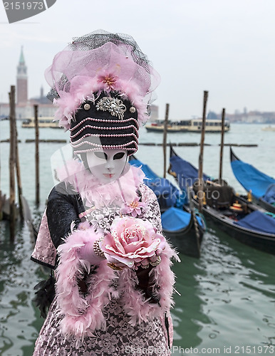 Image of Mask Giving a Rose