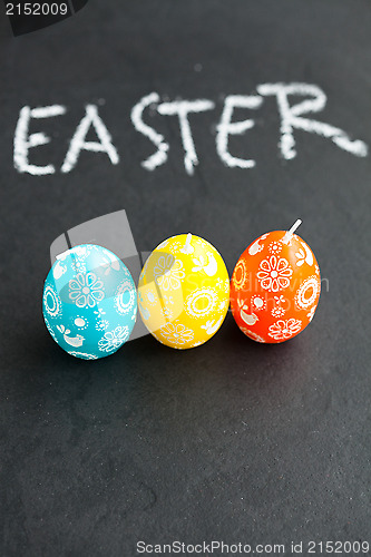 Image of Colorful Easter egg shaped candles and text